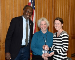 Cathy Lechowicz, right, displaying her award with William Dyson, chairman of the Connecticut Commission on Community Service, and Jane Ciarleglio, executive director of the commission. 